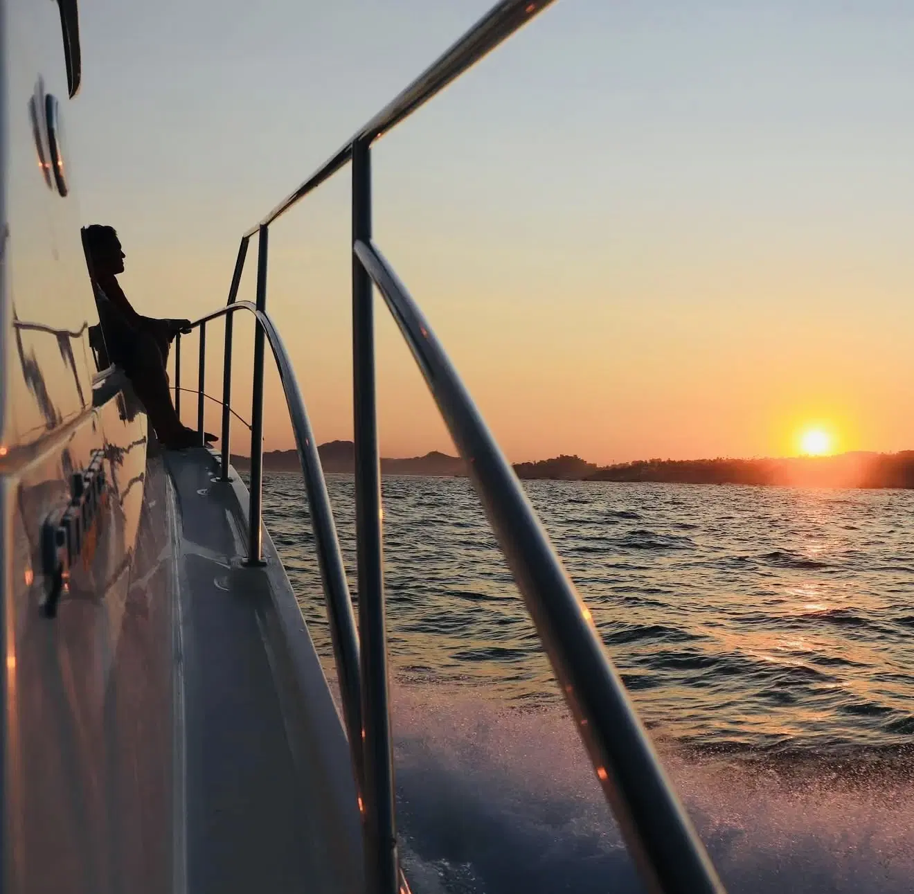 Private yacht cruising at sunset near Cabo San Lucas